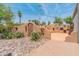 An outdoor kitchen and cooking area with a brick surface, an outdoor grill, and desert landscaping at 15602 N 56Th Pl, Scottsdale, AZ 85254