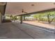 Expansive covered patio with ceiling fans offers a relaxing outdoor space for entertaining and enjoying the backyard at 15602 N 56Th Pl, Scottsdale, AZ 85254