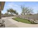 Backyard features a putting green, desert landscaping, and travertine tile, perfect for outdoor entertaining at 16706 N 109Th Way, Scottsdale, AZ 85255