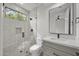 Modern bathroom showcasing glass shower and sleek vanity with elegant fixtures and natural light at 16706 N 109Th Way, Scottsdale, AZ 85255