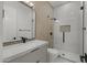 Bathroom with modern fixtures, marble countertop, glass shower, and decorative wall tiles at 16706 N 109Th Way, Scottsdale, AZ 85255