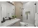 Modern bathroom with a glass enclosed shower, a stylish vanity, and neutral tiling at 16706 N 109Th Way, Scottsdale, AZ 85255