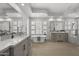 Modern bathroom with dual sinks, a standalone tub, and stylish lighting fixtures at 16706 N 109Th Way, Scottsdale, AZ 85255