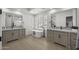 Bright bathroom featuring dual sinks, a standalone tub, and modern fixtures at 16706 N 109Th Way, Scottsdale, AZ 85255