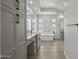 Luxurious bathroom featuring double vanity, soaking tub, glass block window, and modern fixtures at 16706 N 109Th Way, Scottsdale, AZ 85255