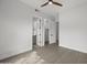 This bedroom has wood-style floors with a ceiling fan and easy access to the bathroom at 16706 N 109Th Way, Scottsdale, AZ 85255