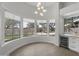 A bright breakfast nook featuring large windows with views of the outdoor pool and landscaping at 16706 N 109Th Way, Scottsdale, AZ 85255