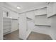 Walk-in closet with ample shelving and neutral finishes at 16706 N 109Th Way, Scottsdale, AZ 85255