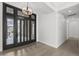 Grand entrance with modern door, chandelier and neutral walls at 16706 N 109Th Way, Scottsdale, AZ 85255