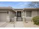 Stunning front entry showcasing modern architectural design and drought-resistant desert landscaping at 16706 N 109Th Way, Scottsdale, AZ 85255