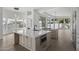 Bright kitchen featuring stainless appliances, an island with marble countertops, and hardwood floors at 16706 N 109Th Way, Scottsdale, AZ 85255