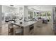 A spacious kitchen with a large island, modern appliances, and open layout that connects to the living space at 16706 N 109Th Way, Scottsdale, AZ 85255