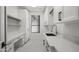 Bright laundry room featuring ample counter space, modern cabinetry, and natural light at 16706 N 109Th Way, Scottsdale, AZ 85255