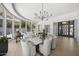 An open-concept living room with modern lighting, views of the landscaped yard, and comfortable seating at 16706 N 109Th Way, Scottsdale, AZ 85255