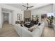 Bright living room featuring a fireplace, modern decor, and a spacious sectional sofa at 16706 N 109Th Way, Scottsdale, AZ 85255