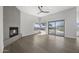 A bright living room featuring a modern fireplace and large windows that let in plenty of natural light at 16706 N 109Th Way, Scottsdale, AZ 85255