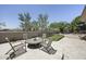 Outdoor patio seating area with a putting green, perfect for entertaining guests at 16706 N 109Th Way, Scottsdale, AZ 85255