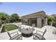 Beautiful patio area with an outdoor table and putting green, perfect for enjoying the Arizona weather at 16706 N 109Th Way, Scottsdale, AZ 85255