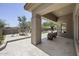 Spacious covered patio featuring outdoor seating areas with a putting green and scenic views at 16706 N 109Th Way, Scottsdale, AZ 85255
