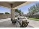 Inviting outdoor patio area with comfortable seating, a putting green, and views of the surrounding landscape at 16706 N 109Th Way, Scottsdale, AZ 85255