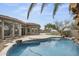 A tranquil pool features rock accents and a small waterfall feature, creating a backyard oasis at 16706 N 109Th Way, Scottsdale, AZ 85255