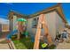 Charming backyard featuring a play set for , artificial grass and a secure fence for a Gathering-friendly outdoor space at 17308 W Daley Ln, Surprise, AZ 85387