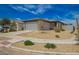 Charming single-story home with desert landscaping, two car garage and covered entry at 17308 W Daley Ln, Surprise, AZ 85387