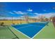 Enjoy a game of tennis at the community court, featuring well-maintained surfaces and scenic surroundings at 17308 W Daley Ln, Surprise, AZ 85387