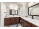 Bright bathroom featuring dual sinks and updated fixtures at 18440 N 43Rd Dr, Glendale, AZ 85308