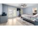 Well-lit bedroom featuring french doors and tiled floors at 18440 N 43Rd Dr, Glendale, AZ 85308