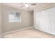 Neutral bedroom with window, tile flooring and large closet at 18440 N 43Rd Dr, Glendale, AZ 85308