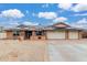 Charming single-story brick home featuring a 3-car garage and solar panels on the roof at 18440 N 43Rd Dr, Glendale, AZ 85308