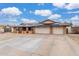 Attractive brick home with a 3-car garage, concrete driveway, and solar panels on roof at 18440 N 43Rd Dr, Glendale, AZ 85308