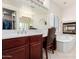 Bathroom with vanity, soaking tub, fireplace and shuttered windows at 19137 W Pasadena Ave, Litchfield Park, AZ 85340