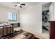 Bedroom with ceiling fan, window and closet at 19137 W Pasadena Ave, Litchfield Park, AZ 85340