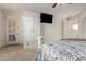 Bedroom featuring a decorative bed with TV and closet at 19137 W Pasadena Ave, Litchfield Park, AZ 85340