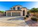 Charming two-story home featuring a 3-car garage and a beautiful landscaped front yard at 19137 W Pasadena Ave, Litchfield Park, AZ 85340