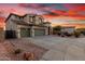 Charming two-story home featuring a 3-car garage and a beautiful landscaped front yard at 19137 W Pasadena Ave, Litchfield Park, AZ 85340