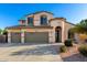 Charming two-story home featuring a 3-car garage and a beautiful landscaped front yard at 19137 W Pasadena Ave, Litchfield Park, AZ 85340