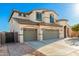 Beautiful two-story stucco home featuring a tile roof and spacious three-car garage at 19137 W Pasadena Ave, Litchfield Park, AZ 85340