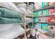 Organized linen closet with shelves stocked with towels, blankets, and baby products at 19675 E Oriole Way, Queen Creek, AZ 85142