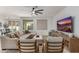 Cozy living room showcasing modern furniture, a large TV, and a neutral color palette at 19675 E Oriole Way, Queen Creek, AZ 85142