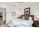 Bright bedroom featuring a ceiling fan, wood furniture and stylish accents at 19777 N 76Th St # 1219, Scottsdale, AZ 85255