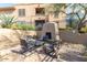 Charming outdoor patio with an adobe fireplace and comfortable seating, ideal for relaxing and entertaining at 19777 N 76Th St # 1219, Scottsdale, AZ 85255