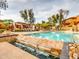 Beautiful community pool with water feature, lounge chairs, and cabanas at 19777 N 76Th St # 1219, Scottsdale, AZ 85255