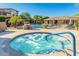 Beautiful community pool area featuring a relaxing jacuzzi tub and comfortable lounge seating for residents at 19777 N 76Th St # 1219, Scottsdale, AZ 85255