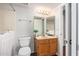 Bathroom features a vanity, mirror, toilet, and walk-in tub at 19820 N 13Th Ave # 169, Phoenix, AZ 85027