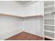 An organized walk-in closet provides ample shelving and hanging storage space at 19820 N 13Th Ave # 169, Phoenix, AZ 85027