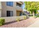 Two-story condo with lush landscaping and a private outdoor patio at 19820 N 13Th Ave # 169, Phoenix, AZ 85027