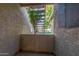 A covered patio with view of the common areas and stairs to the upper level at 19820 N 13Th Ave # 169, Phoenix, AZ 85027